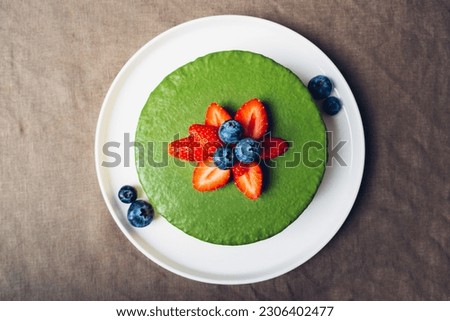 Similar – Image, Stock Photo Matcha cheesecake flat lay. Woman hands taking cake slice