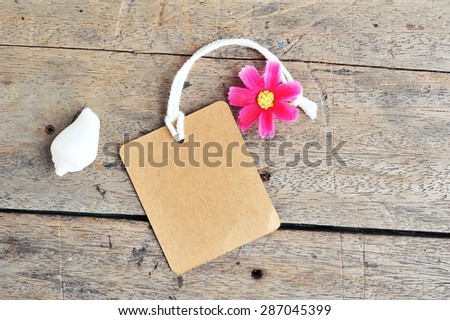 Vintage of the blank price tag label on wooden background.