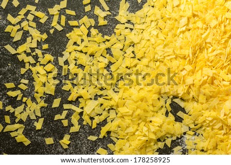 Grandmother\'s home made pasta on black surface