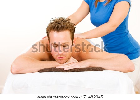 Massage: Man Relaxes On Table During Massage