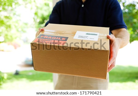 Delivery: Anonymous Delivery Man With Package