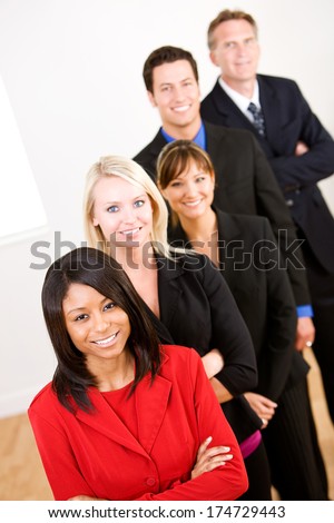 Business: Smiling Employees Lined Up