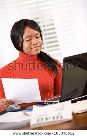 Taxes: Woman Using Computer To Work Out Taxes