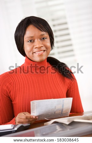 Taxes: Smiling Woman Working On Taxes