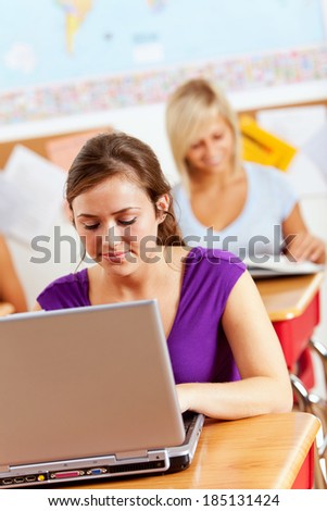 Students: Student Using Laptop Computer For Classwork