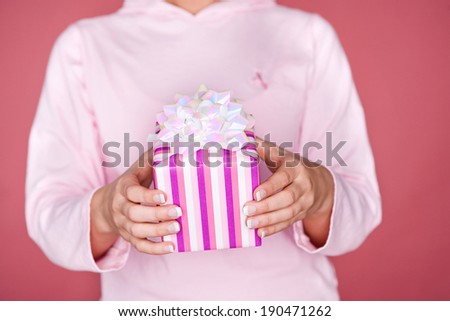 Pink: Woman Holding A Pink Wrapped Gift