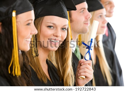 Graduation: Girl Graduate Peers Out From Line Of Friends