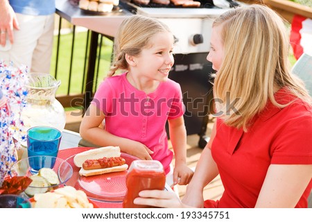 Summer: Girl And Mother Ready To Eat Dinner