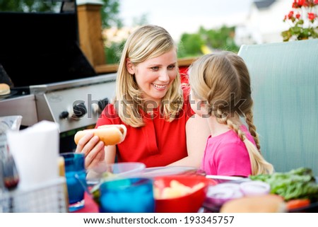 Summer: Mother And Daughter Get Ready To Eat Dinner