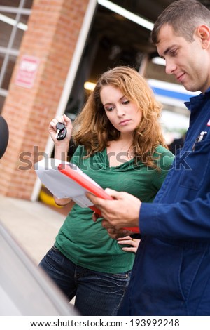 Mechanic: Customer And Service Tech Look At Bill