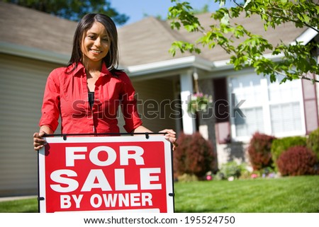 Home: Woman Stands Behind For Sale By Owner Sign