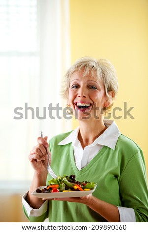 Couple: Laughing Woman Eats Healthy Dinner