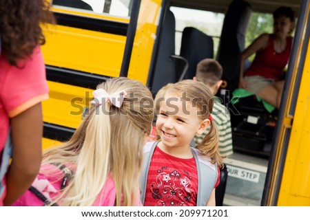 Education: Friends Talking While Boarding School Bus