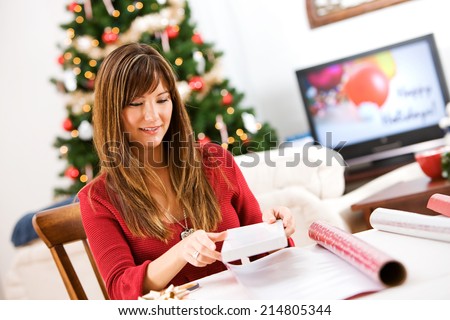 Christmas: Woman Getting Ready To Wrap Small Cardboard Box