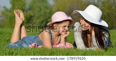 Panorama of mother and daughter on vacation in the park