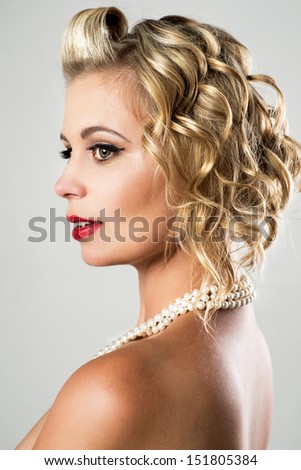 beautiful woman with pearls and retro hair