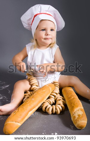 Happy little girl with chef hat