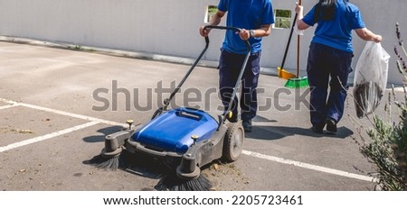 Similar – Image, Stock Photo Two asphalt parking spaces in front of a colourful concrete wall and the shadow of a railing
