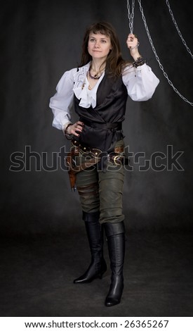 The girl - pirate and metal chain on black background