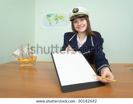 The girl in a sea uniform at office with tablet