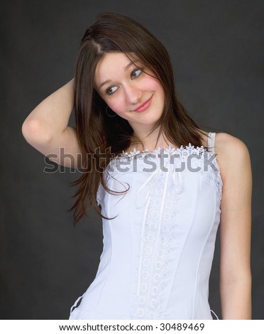 Timid confused girl in a white dress