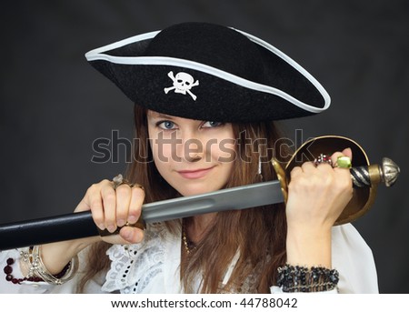 Portrait of the woman - pirate getting a sabre from a sheath