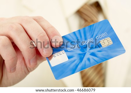 Businessman shows a blue plastic credit card