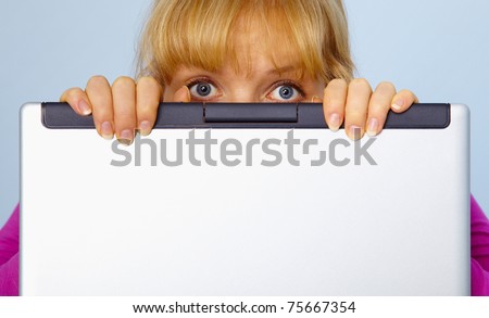 Frightened, the woman was guilty and hides behind a computer screen