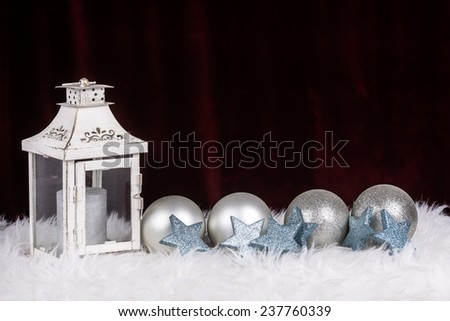 Christmas decoration with lamp and balls in silver color and with red space for wishes