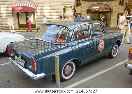 MOSCOW, RUSSIA - July 26, 2014: Soviet car Moskvich-408 on retro rally Gorkyclassic in the Parking lot near Gum Department store, Moscow, side view