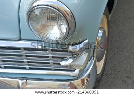 MOSCOW, RUSSIA - July 26, 2014: Car Moskvich-403IE on retro rally Gorkyclassic,  GUM, Moscow, fragment with headlight