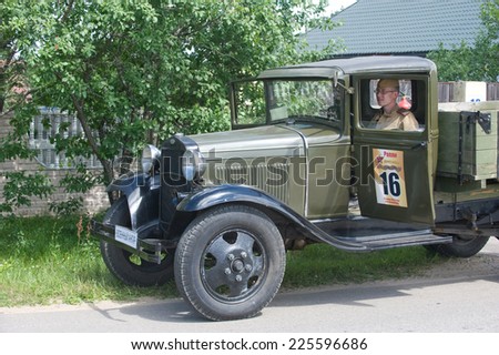 CHERNOGOLOVKA, MOSCOW REGION, RUSSIA - JUNE 21, 2013: Soviet old GAZ-AA-with a driver at the 3rd international meeting of \