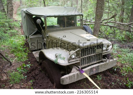 CHERNOGOLOVKA, MOSCOW REGION, RUSSIA-JUNE 21, 2013: American car Dodge WC-51 stuck in the woods on a heavy road, 3rd international meeting \