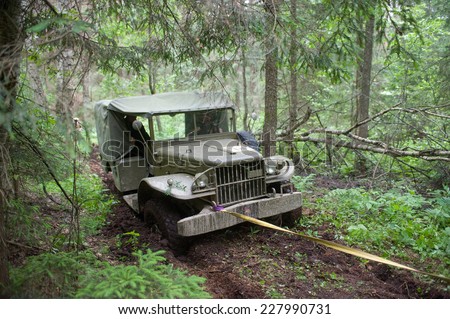 CHERNOGOLOVKA, MOSCOW REGION, RUSSIA-JUNE 21, 2013: American military retro car Dodge WC-51 stuck in the woods on a heavy road, 3rd international meeting \