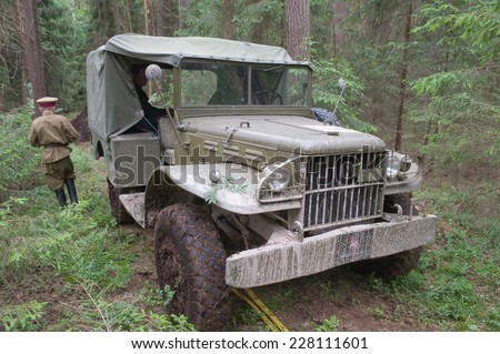 CHERNOGOLOVKA, MOSCOW REGION, RUSSIA-JUNE 21, 2013: Old U.S. army Dodge WC-51 stuck in the woods on a heavy road, 3rd international meeting \