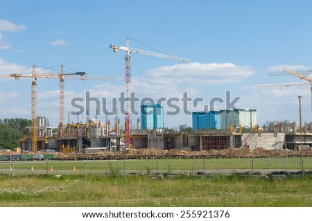 MOSCOW, RUSSIA - July 1, 2012: Tushino airfield in the summer, the views of the cranes on the construction of the stadium \
