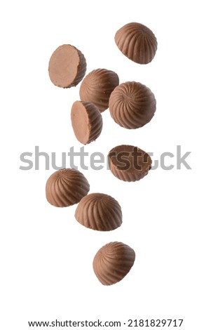 Similar – Image, Stock Photo Many colorful candies fall down in front of a black background