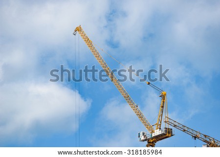 Khon Kaen, Thailand - September 19, 2015:Yellow construction tower crane against blue sky
