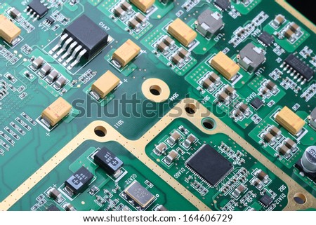 Application Specific Integrated Circuit, inductors, chip capacitors, and chip resistors mounted on a Printed Wiring Board