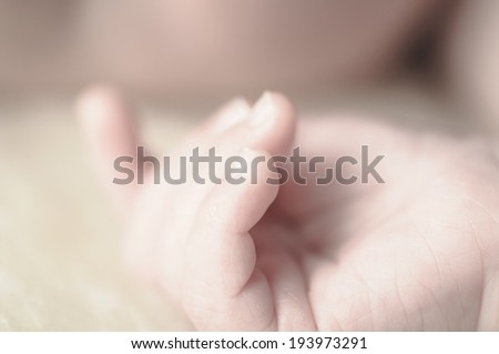 Close up of baby girls\' sweet little hand and fingers