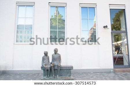 Copenhagen, Denmark - August 25, 2014 - A old couple statue in downtown square, Copenhagen, Denmark.
