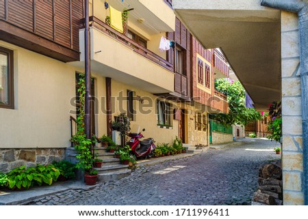 Similar – Image, Stock Photo Passage between small town houses in summer