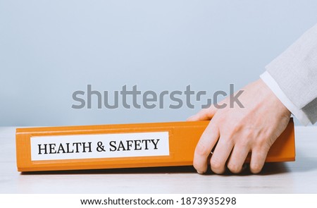 Health and safety labor protection and regulations at work place. Folder with documents or instructions. employees and their rights. Guidance or induction. Copy space Photo stock © 