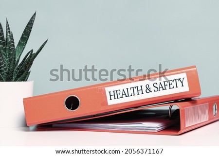 Health and safety labor protection and regulations at work place. Folder with documents or instructions. employees and their rights. Guidance or induction. Copy space. Office desk Photo stock © 