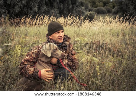 Similar – Image, Stock Photo Man and Weimaraner hunting dog at the sea in Norway