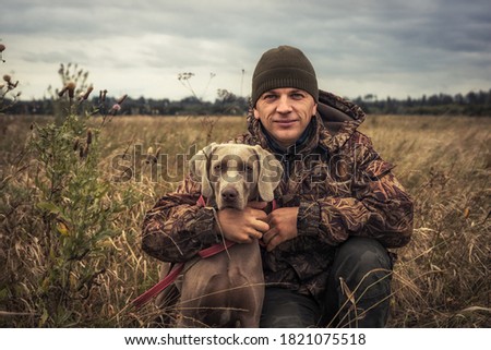 Similar – Image, Stock Photo Man and Weimaraner hunting dog at the sea in Norway