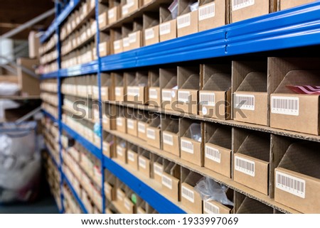Up close view of pigeon holes used in a factory warehouse for storage of the raw materials. Warehouse, stores, storage, raw materials concept