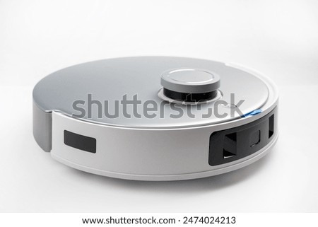 Similar – Image, Stock Photo A robot vacuum cleaner cleans the apartment diligently and independently and makes household chores easier