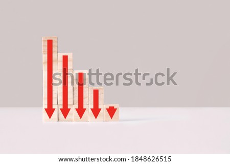 Ladder made of wooden blocks with red arrows down, side view. Decline, decrease, down, drop. Business statistic. Career, money, success concept. Regression, crisis. 商業照片 © 