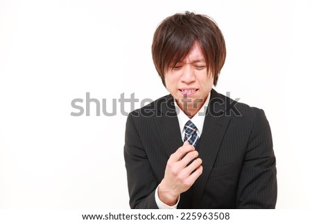 young Japanese businessman cries